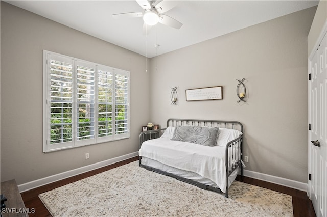 bedroom featuring dark wood-type flooring and ceiling fan