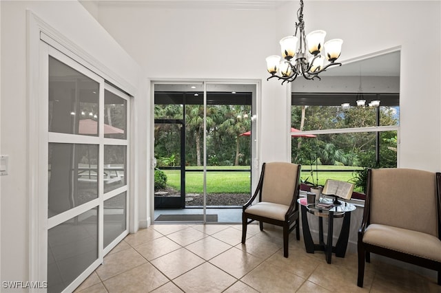 sunroom / solarium featuring an inviting chandelier and plenty of natural light