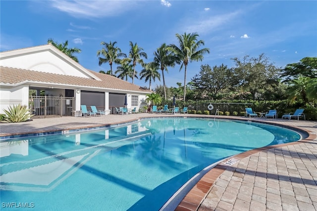 view of swimming pool with a patio