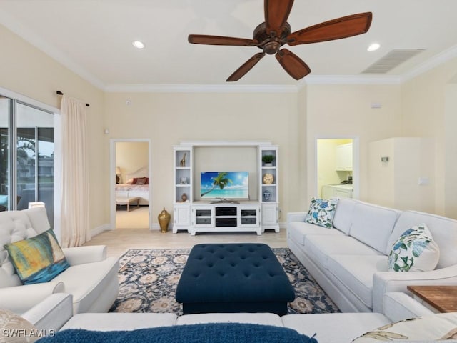 living room with ceiling fan and ornamental molding