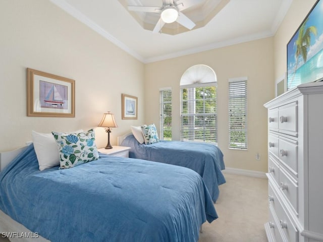 carpeted bedroom featuring ceiling fan and crown molding