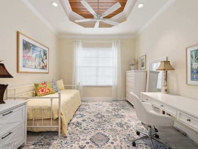 bedroom featuring a raised ceiling, ceiling fan, and crown molding