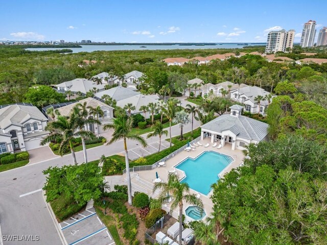 birds eye view of property with a water view