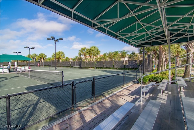 view of sport court with fence