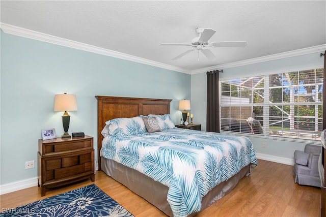 bedroom with ceiling fan, crown molding, and hardwood / wood-style flooring