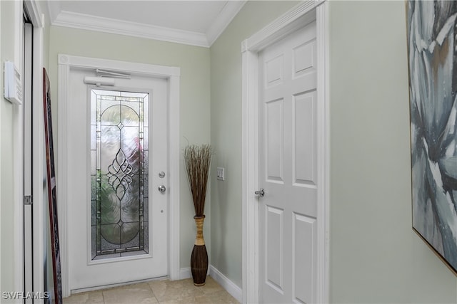 entryway with baseboards, ornamental molding, and light tile patterned flooring