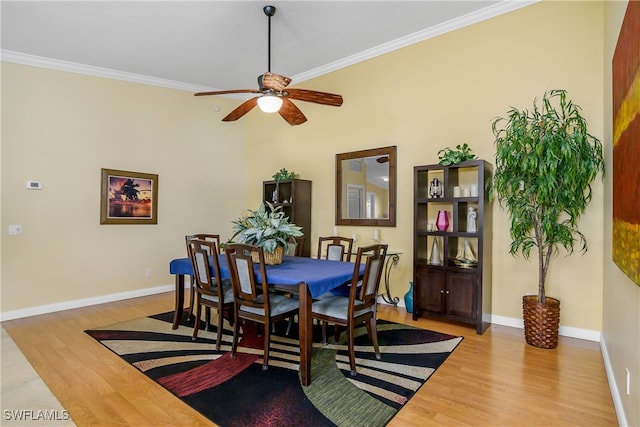 dining room featuring hardwood / wood-style floors, ceiling fan, and ornamental molding