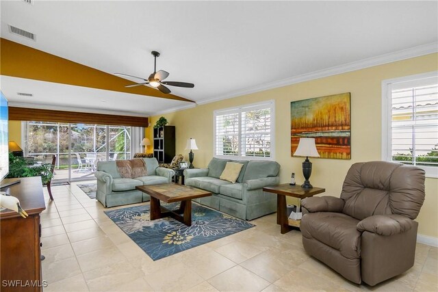 tiled living room featuring lofted ceiling, ceiling fan, and crown molding