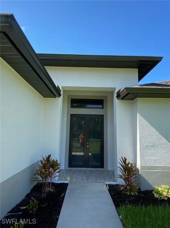 entrance to property featuring french doors