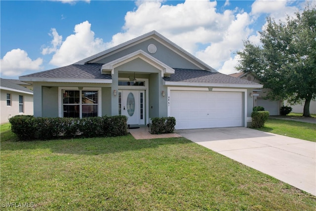 view of front facade with a front yard and a garage