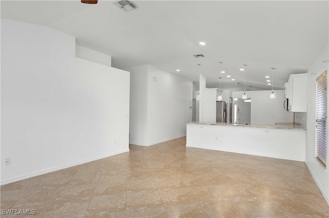 unfurnished living room with lofted ceiling