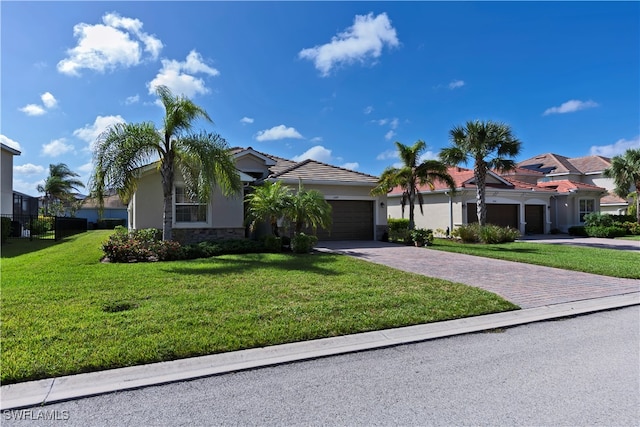 view of front of home featuring a garage and a front lawn