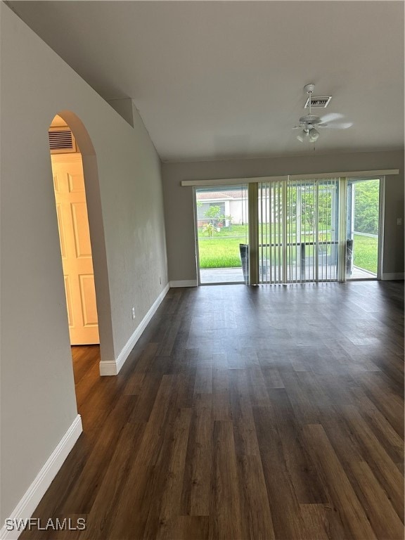 spare room featuring ceiling fan, lofted ceiling, and dark hardwood / wood-style floors