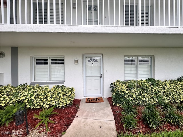 doorway to property featuring a balcony