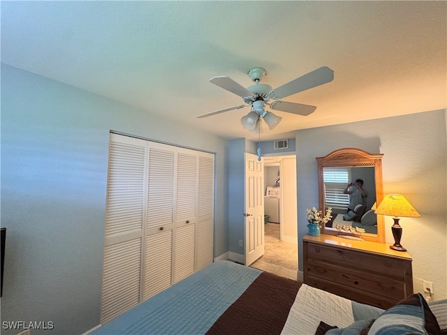 bedroom featuring a closet, washer / dryer, and ceiling fan