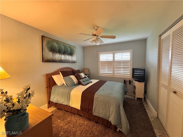 bedroom with ceiling fan and a closet