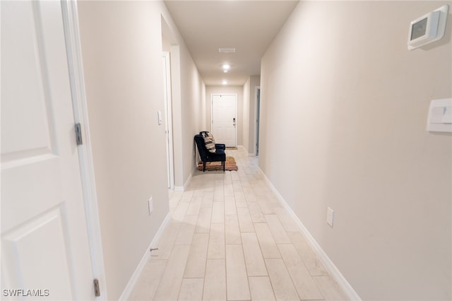 hallway featuring light hardwood / wood-style flooring