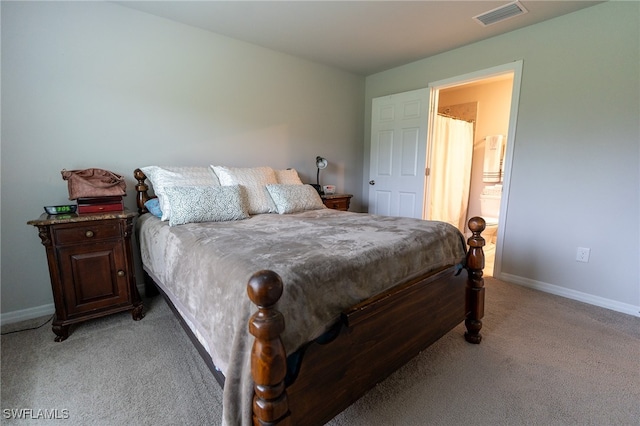 bedroom featuring light carpet