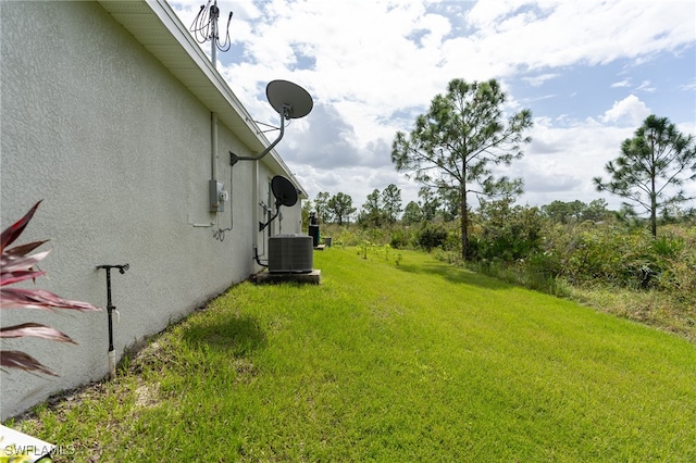 view of yard with central AC