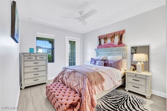 bedroom with ceiling fan and light hardwood / wood-style flooring