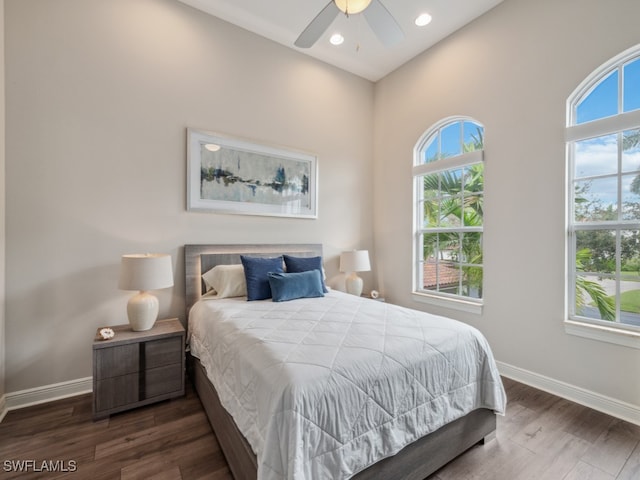 bedroom featuring ceiling fan and dark hardwood / wood-style flooring