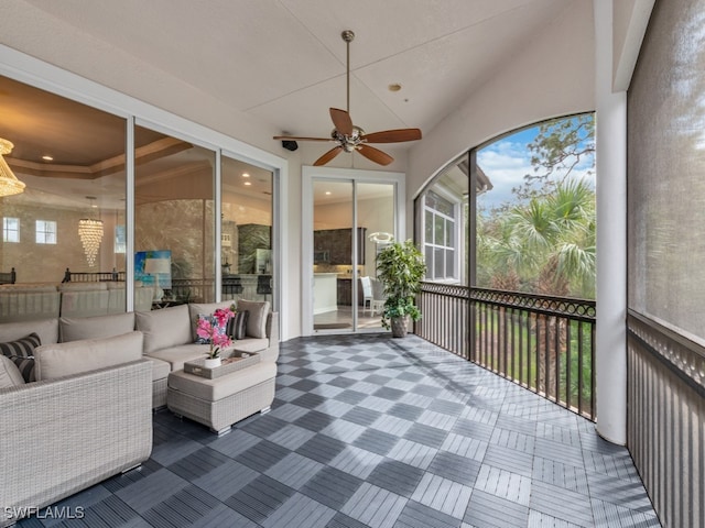 sunroom featuring ceiling fan