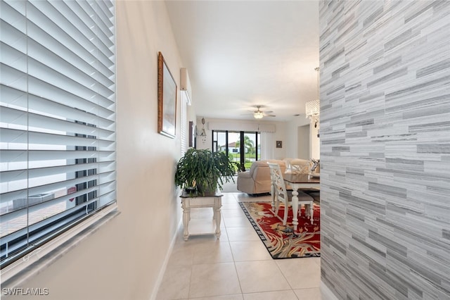 hall featuring light tile patterned floors