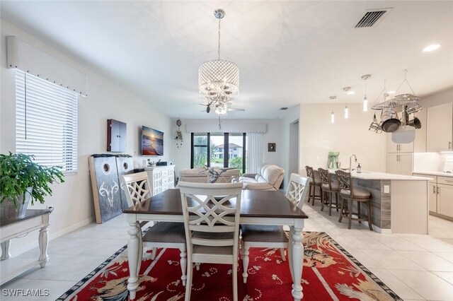 dining room with ceiling fan and light tile patterned floors