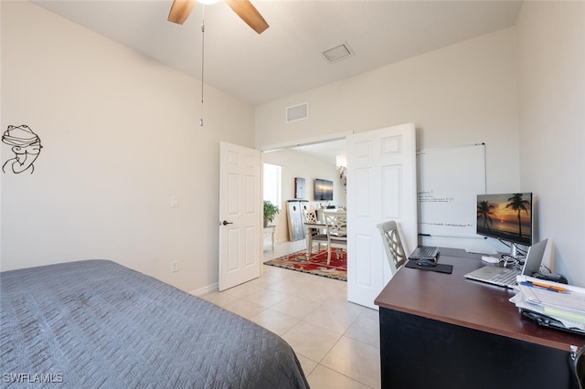 bedroom with ceiling fan and light tile patterned floors