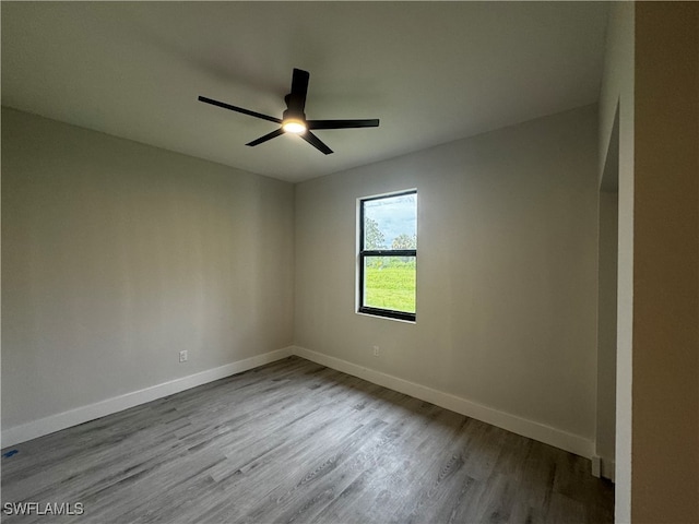 spare room with ceiling fan and light hardwood / wood-style floors