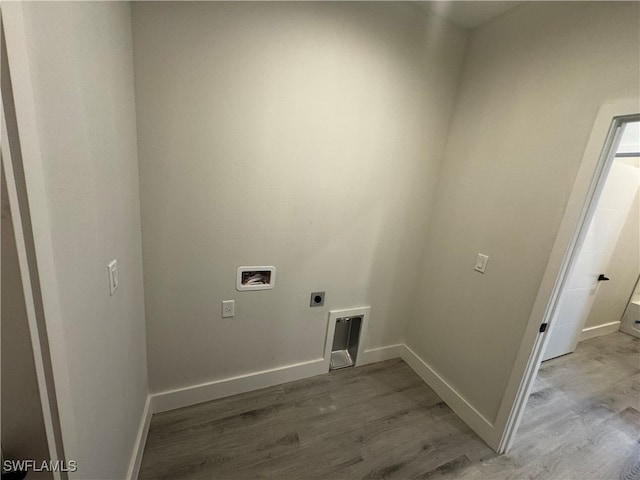 washroom with washer hookup, hookup for an electric dryer, and light wood-type flooring