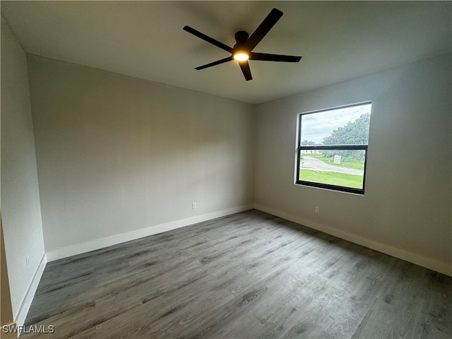 unfurnished room featuring ceiling fan and hardwood / wood-style floors