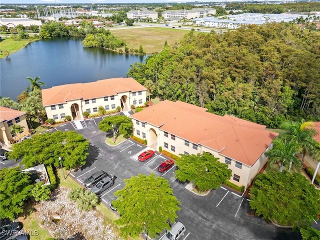 birds eye view of property with a water view