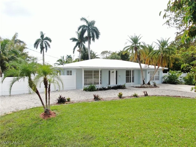 single story home featuring a porch and a front yard