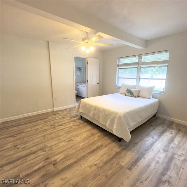 22 Constitution Dr, Naples, FL 34112 - bedroom featuring wood finished floors, beam ceiling, baseboards, ceiling fan, and ensuite bathroom