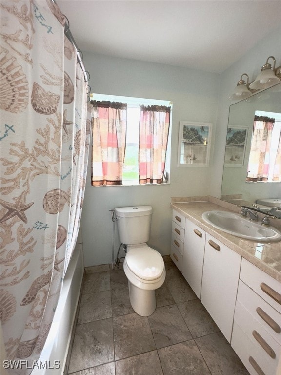 full bathroom featuring shower / bath combination with curtain, vanity, and toilet