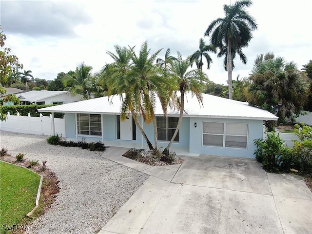 22 Constitution Dr, Naples, FL 34112 - single story home featuring stucco siding, fence, and driveway