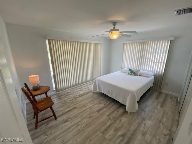 22 Constitution Dr, Naples, FL 34112 - bedroom featuring ceiling fan, baseboards, light wood-style floors, and visible vents