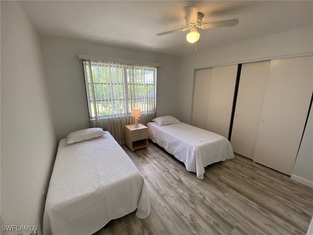 22 Constitution Dr, Naples, FL 34112 - bedroom with ceiling fan, wood finished floors, and a closet