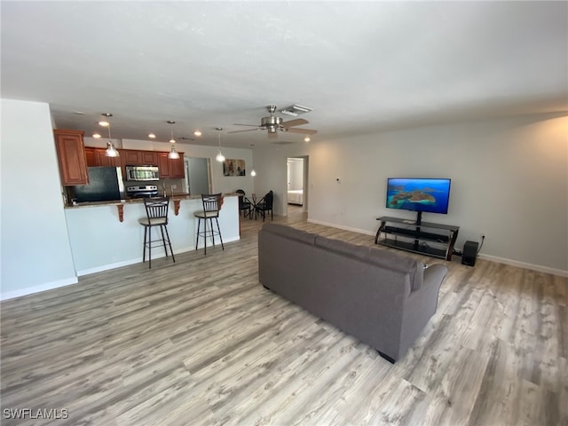 22 Constitution Dr, Naples, FL 34112 - living area featuring light wood-type flooring, baseboards, and ceiling fan