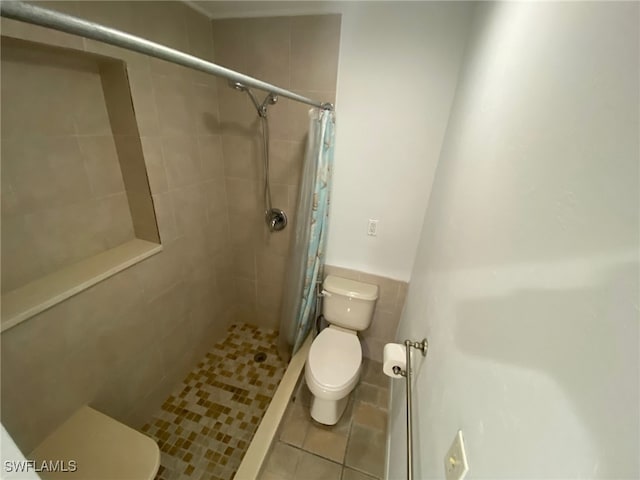 22 Constitution Dr, Naples, FL 34112 - bathroom with toilet, tile patterned flooring, and tiled shower