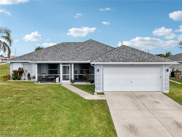 ranch-style home with a front lawn and a garage