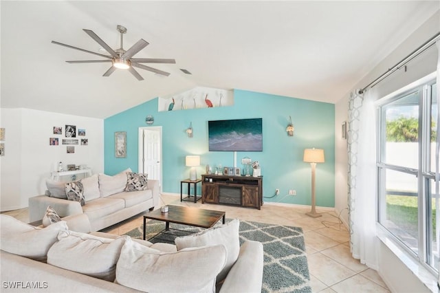 living room with light tile patterned floors, baseboards, lofted ceiling, and ceiling fan