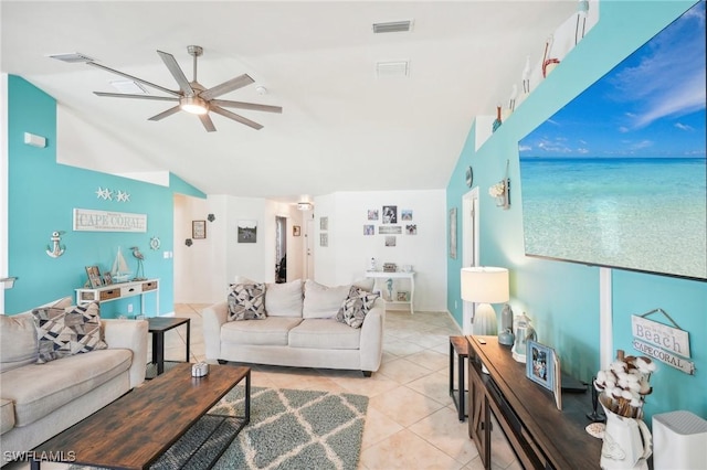 living area featuring light tile patterned floors, visible vents, lofted ceiling, and ceiling fan