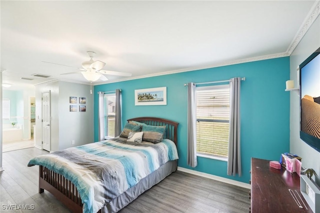 bedroom featuring multiple windows, wood finished floors, and ornamental molding