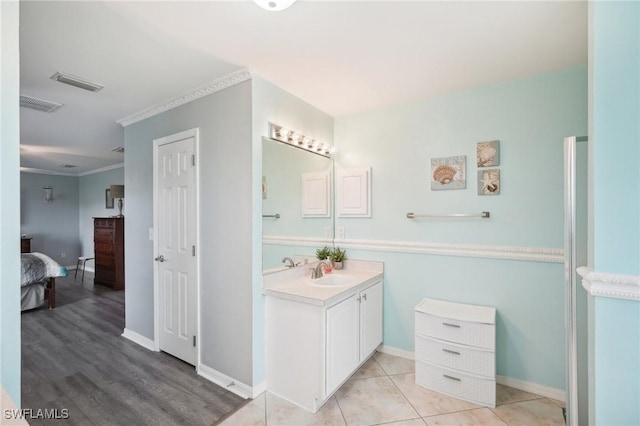 full bathroom featuring vanity, visible vents, ensuite bathroom, and ornamental molding