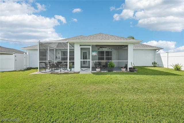 rear view of property with a yard, a patio, a fenced backyard, and a gate