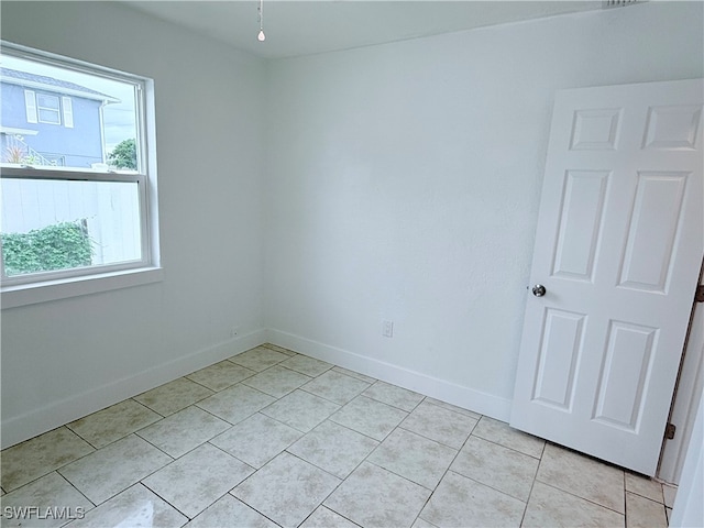 view of tiled spare room