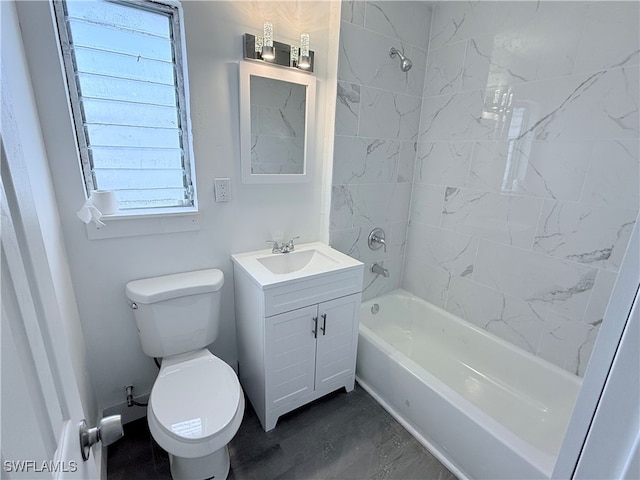 full bathroom with toilet, tiled shower / bath combo, and vanity