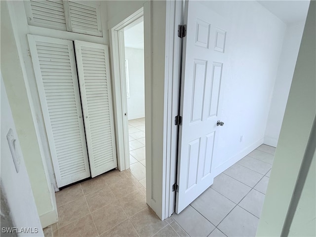 hallway with light tile patterned flooring